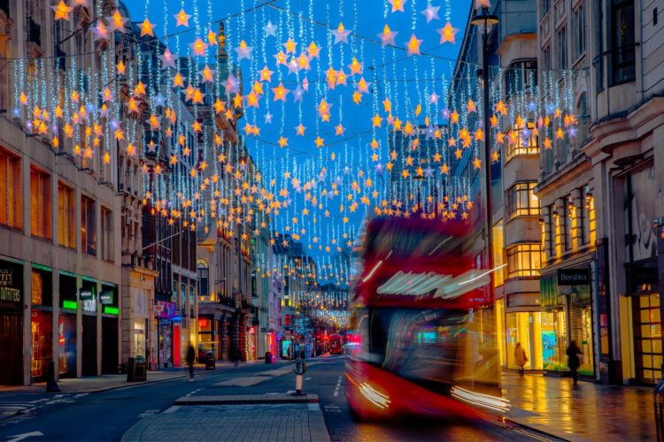 Christmas lights above a shopping street in a city